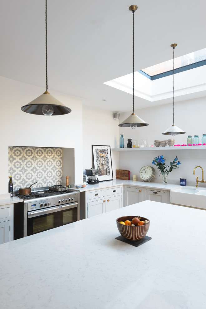 Example of a mid-sized country kitchen design in London