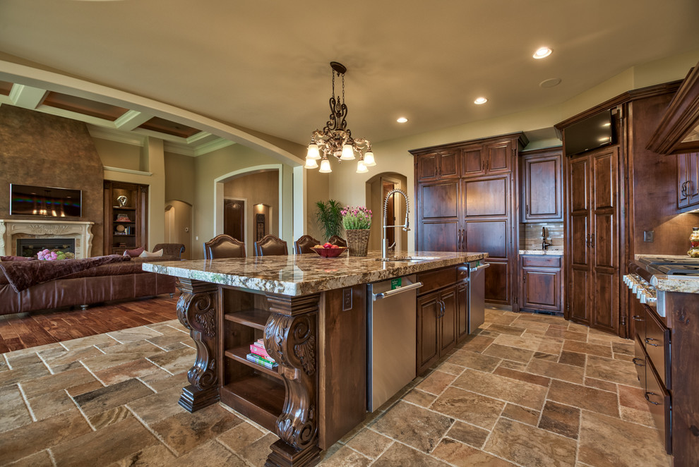 Large tuscan single-wall slate floor and beige floor kitchen photo in Omaha with a double-bowl sink, raised-panel cabinets, dark wood cabinets, granite countertops, beige backsplash, stainless steel appliances and an island