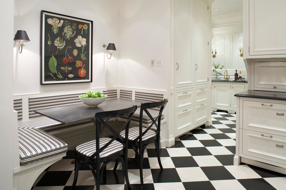 Inspiration för ett mellanstort vintage svart svart kök, med en undermonterad diskho, luckor med infälld panel, bänkskiva i kvartsit, vitt stänkskydd, stänkskydd i trä, integrerade vitvaror, klinkergolv i keramik och svart golv