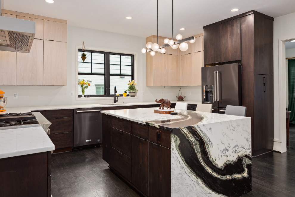 Medium sized contemporary u-shaped enclosed kitchen in DC Metro with a submerged sink, flat-panel cabinets, dark wood cabinets, grey splashback, stainless steel appliances, dark hardwood flooring, an island, brown floors and white worktops.