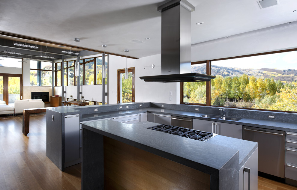 Modern open plan kitchen in Denver with stainless steel appliances.