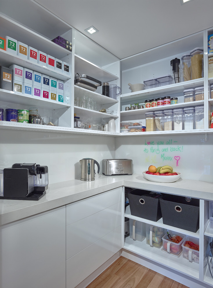 Inspiration for a small contemporary kitchen pantry in Adelaide with open cabinets, white cabinets and white splashback.