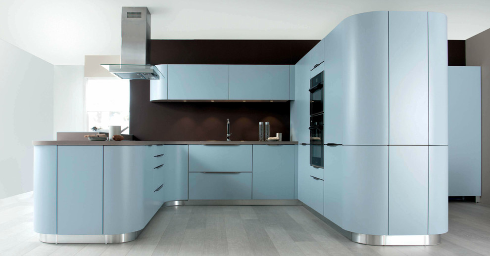 Medium sized modern u-shaped open plan kitchen in London with a built-in sink, flat-panel cabinets, blue cabinets, quartz worktops, brown splashback, integrated appliances, a breakfast bar, laminate floors and grey floors.