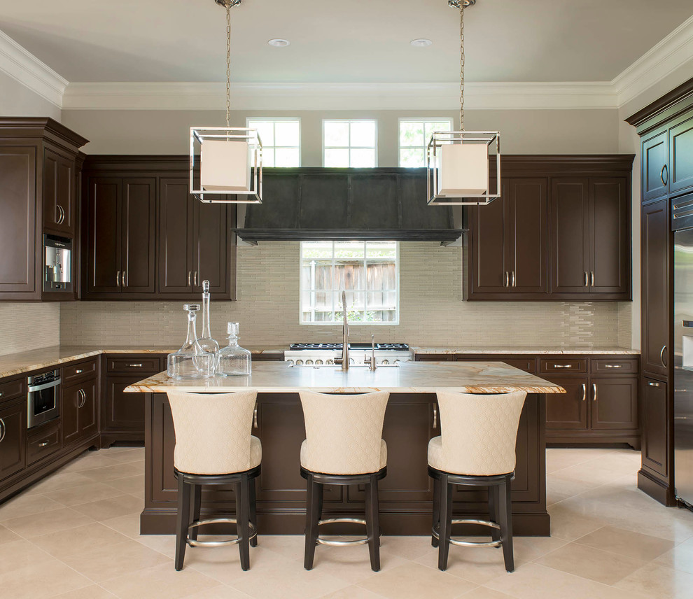 Inspiration for a large transitional u-shaped marble floor and beige floor eat-in kitchen remodel in Other with shaker cabinets, dark wood cabinets, beige backsplash, stainless steel appliances, an island, glass tile backsplash, a farmhouse sink and marble countertops