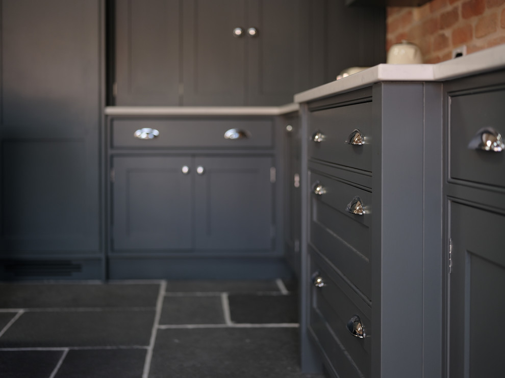 Inspiration for a traditional kitchen in Cheshire with quartz worktops, slate flooring, an island and grey floors.