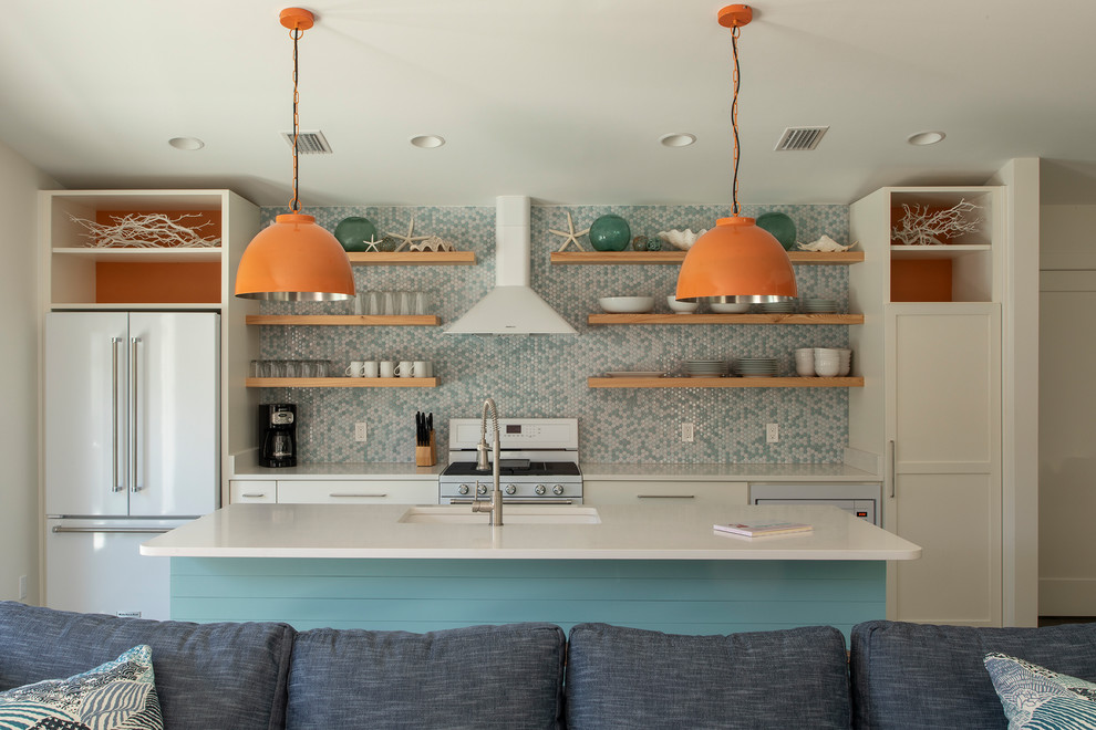 Inspiration for a mid-sized 1950s single-wall ceramic tile and brown floor open concept kitchen remodel in Miami with an undermount sink, recessed-panel cabinets, turquoise cabinets, quartzite countertops, multicolored backsplash, ceramic backsplash, white appliances, an island and white countertops