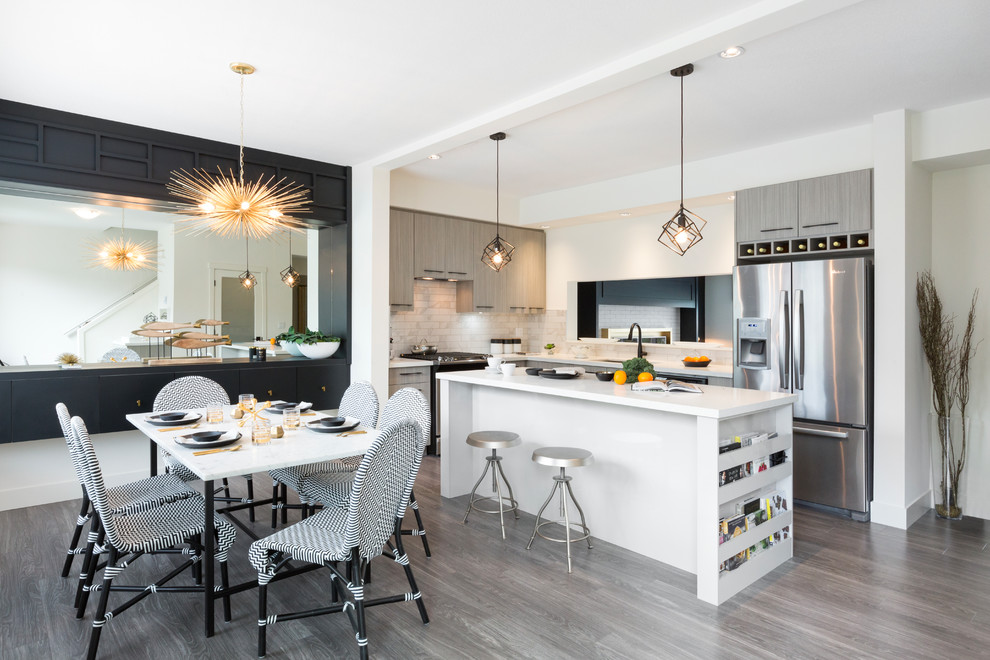 Inspiration for a contemporary l-shaped eat-in kitchen remodel in Vancouver with an undermount sink, flat-panel cabinets, white backsplash, stainless steel appliances and an island