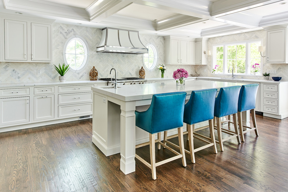 Large transitional u-shaped medium tone wood floor and pink floor eat-in kitchen photo in New York with an island, an undermount sink, beaded inset cabinets, white cabinets, quartz countertops and paneled appliances