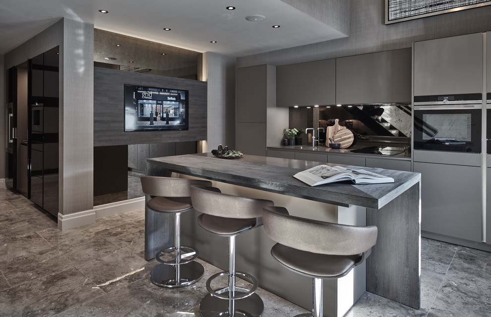 Photo of a medium sized contemporary enclosed kitchen in Other with a built-in sink, flat-panel cabinets, brown cabinets, granite worktops, brown splashback, mirror splashback, black appliances, porcelain flooring, an island and brown floors.