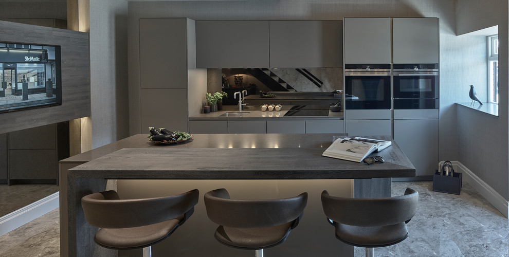 Inspiration for a medium sized contemporary enclosed kitchen in Other with a built-in sink, flat-panel cabinets, brown cabinets, granite worktops, brown splashback, mirror splashback, black appliances, porcelain flooring, an island and brown floors.