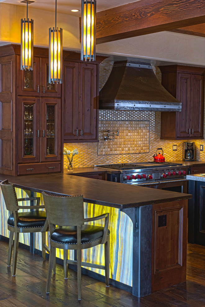 Large elegant u-shaped medium tone wood floor eat-in kitchen photo in Denver with an undermount sink, recessed-panel cabinets, medium tone wood cabinets, solid surface countertops, beige backsplash, mosaic tile backsplash, stainless steel appliances and an island