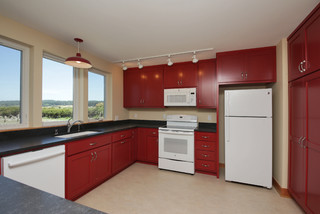 GE Profile #kitchen with red walls, white #cabinets and white