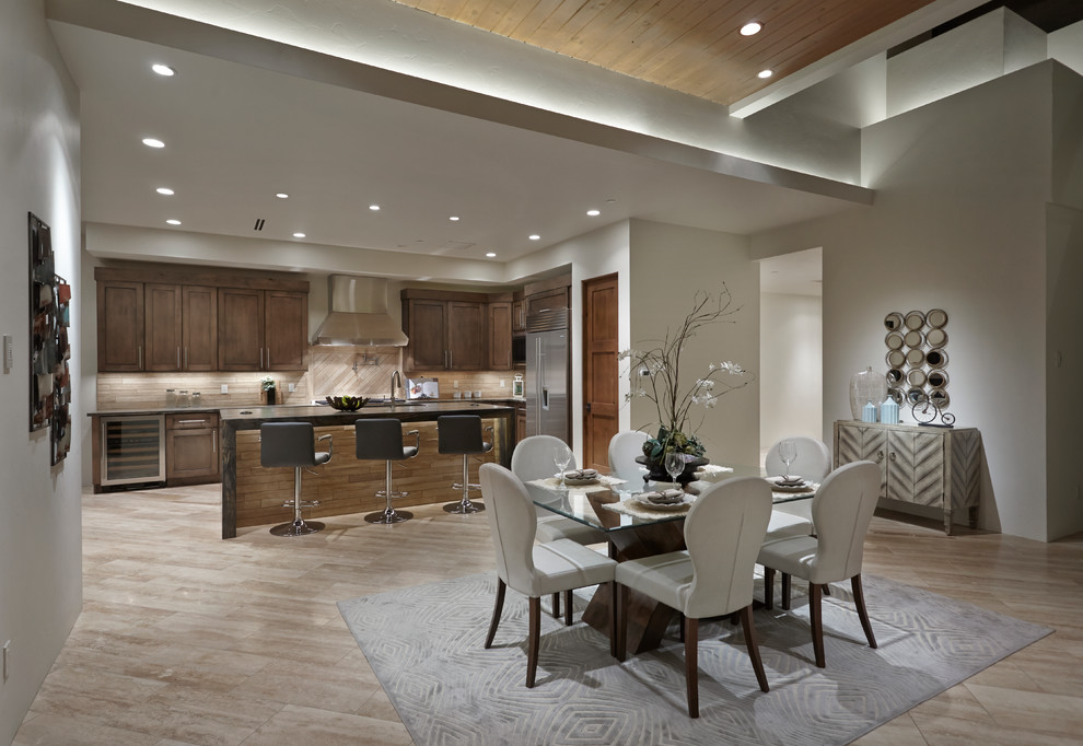 Open concept kitchen - mid-sized contemporary l-shaped travertine floor open concept kitchen idea in Phoenix with an undermount sink, shaker cabinets, brown cabinets, quartzite countertops, brown backsplash, stone tile backsplash, stainless steel appliances and an island