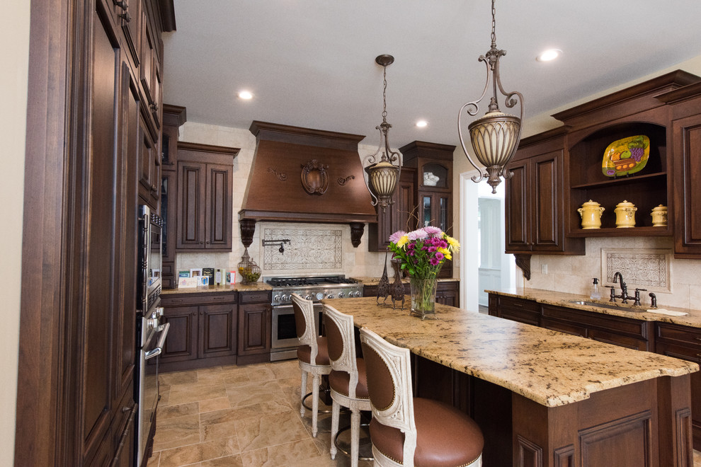 Inspiration for a large timeless u-shaped ceramic tile eat-in kitchen remodel in New York with an integrated sink, beaded inset cabinets, dark wood cabinets, granite countertops, beige backsplash, ceramic backsplash, stainless steel appliances and an island
