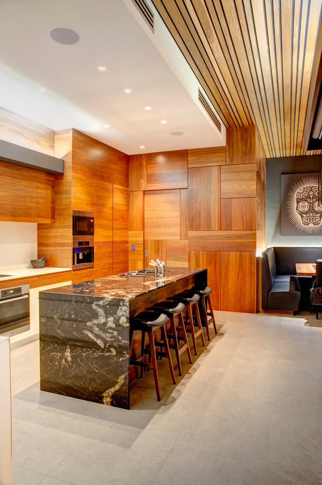 Kitchen - large contemporary kitchen idea in Gold Coast - Tweed with recessed-panel cabinets, medium tone wood cabinets, marble countertops and an island
