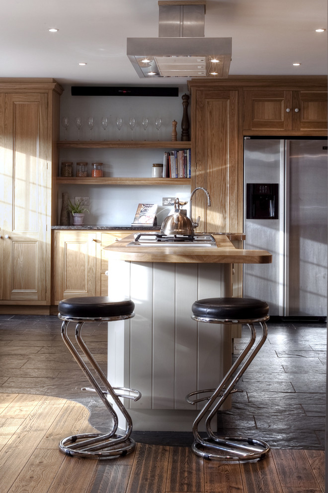 Design ideas for a classic kitchen in London with stainless steel appliances and wood worktops.