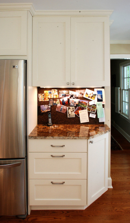 Cottage medium tone wood floor kitchen photo in Detroit with recessed-panel cabinets and white cabinets