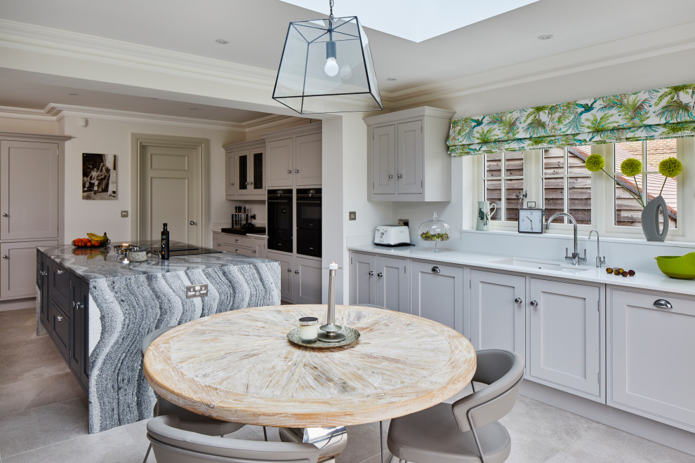 Example of a large transitional l-shaped gray floor open concept kitchen design in Kent with quartzite countertops, an undermount sink, shaker cabinets, gray cabinets, white backsplash, an island and white countertops