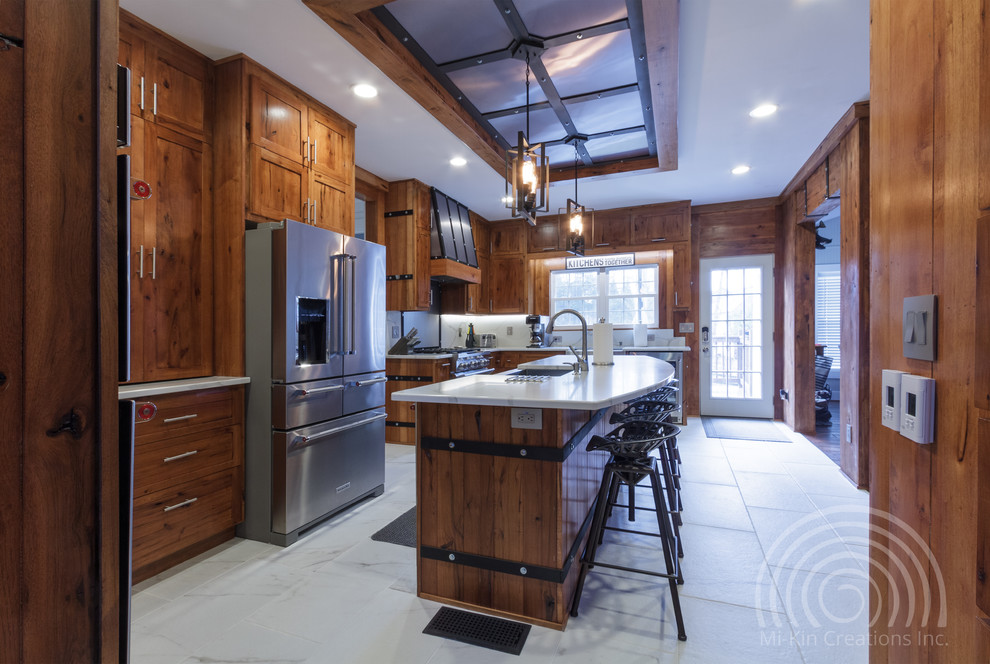 Photo of an expansive classic u-shaped open plan kitchen in Atlanta with a belfast sink, flat-panel cabinets, light wood cabinets, engineered stone countertops, white splashback, stone slab splashback, stainless steel appliances, marble flooring, an island, white floors and white worktops.