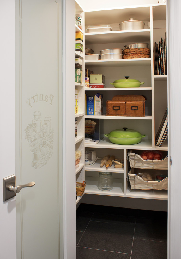 This is an example of a small contemporary l-shaped kitchen pantry in New York with open cabinets, white cabinets, ceramic flooring and grey floors.