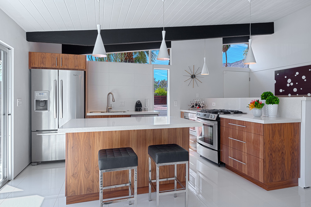 Inspiration for a medium sized midcentury l-shaped kitchen in Other with a submerged sink, flat-panel cabinets, quartz worktops, white splashback, stone slab splashback, stainless steel appliances, ceramic flooring and an island.