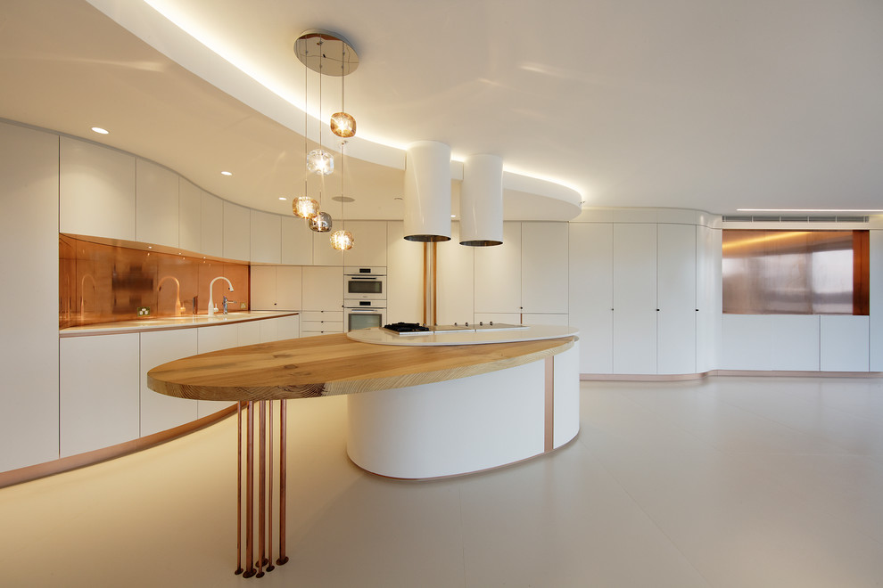 Inspiration for a large modern l-shaped open plan kitchen in Sydney with a submerged sink, flat-panel cabinets, white cabinets, composite countertops, metallic splashback, metal splashback, white appliances, ceramic flooring, an island and beige floors.