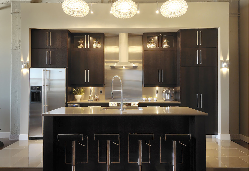 Inspiration for a contemporary galley kitchen remodel in Other with stainless steel appliances, an undermount sink, flat-panel cabinets, dark wood cabinets, metallic backsplash and metal backsplash