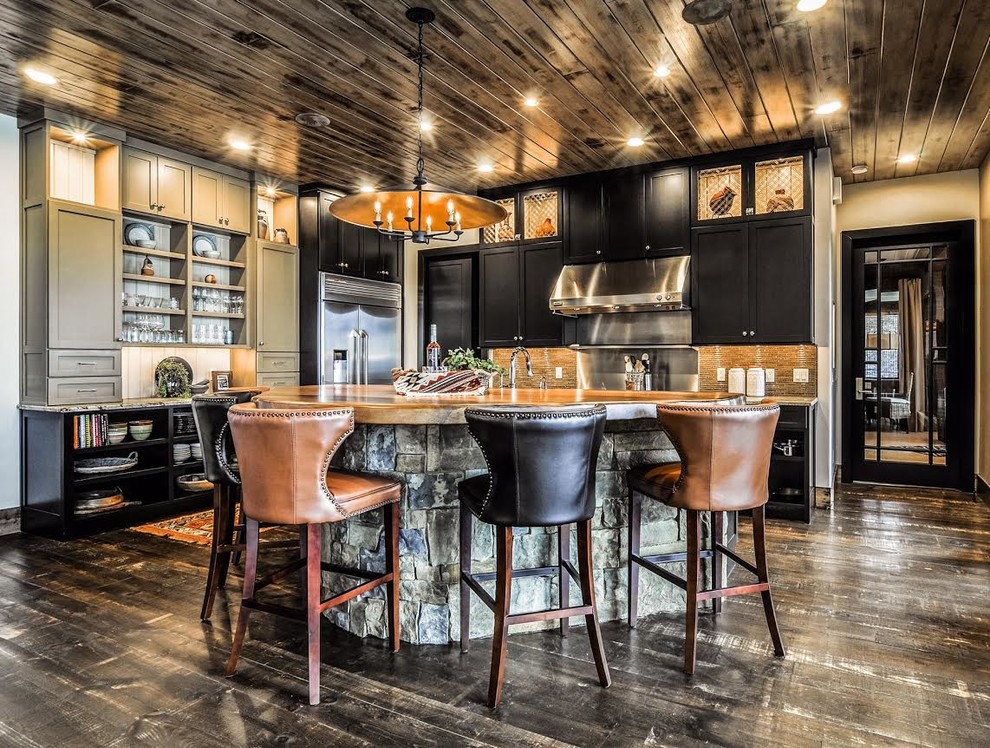 Inspiration for a large rustic l-shaped dark wood floor and brown floor open concept kitchen remodel in Other with shaker cabinets, black cabinets, stainless steel appliances, an island, brown backsplash, matchstick tile backsplash and a farmhouse sink