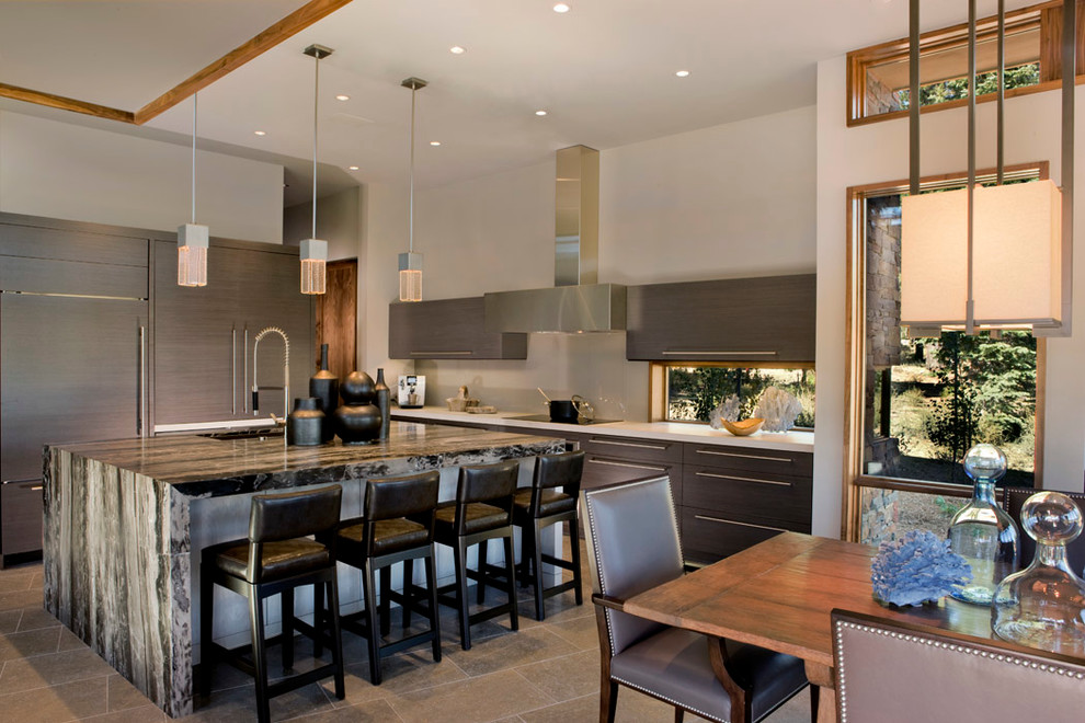 This is an example of a contemporary l-shaped kitchen/diner in Sacramento with flat-panel cabinets, integrated appliances, a submerged sink, grey cabinets, an island and white splashback.