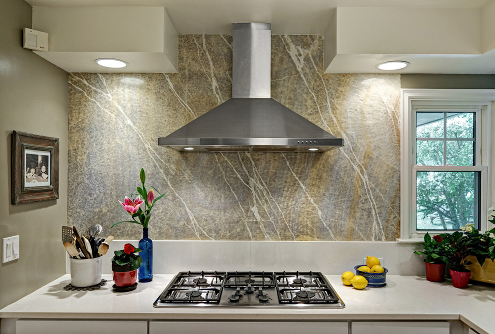 Example of a mid-sized transitional eat-in kitchen design in Minneapolis with shaker cabinets, white cabinets, quartz countertops, yellow backsplash, stone slab backsplash, stainless steel appliances and a peninsula