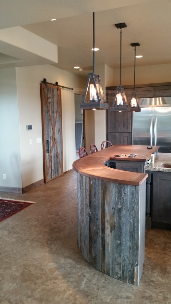 Eat-in kitchen - large rustic u-shaped concrete floor eat-in kitchen idea in Phoenix with shaker cabinets, gray cabinets, stone slab backsplash, stainless steel appliances, two islands and wood countertops