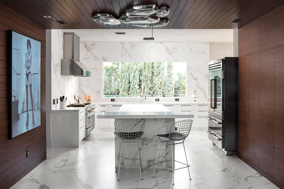 Inspiration for a contemporary u-shaped white floor eat-in kitchen remodel in Orlando with flat-panel cabinets, dark wood cabinets, white backsplash, stainless steel appliances, an island and white countertops