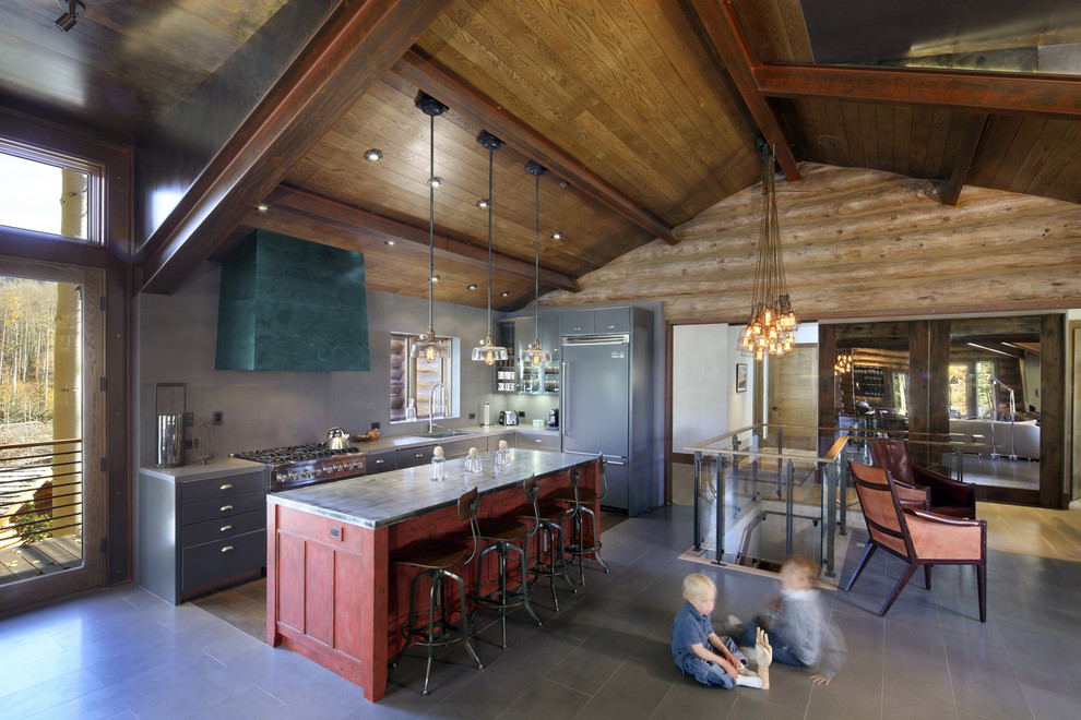 This is an example of a rustic kitchen in Denver with stainless steel appliances.