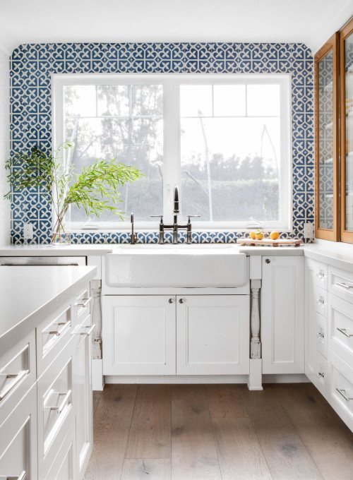 A Touch of the Blues: Blue Patterned Ceramic Backsplash with Light Gray Quartz Countertops
