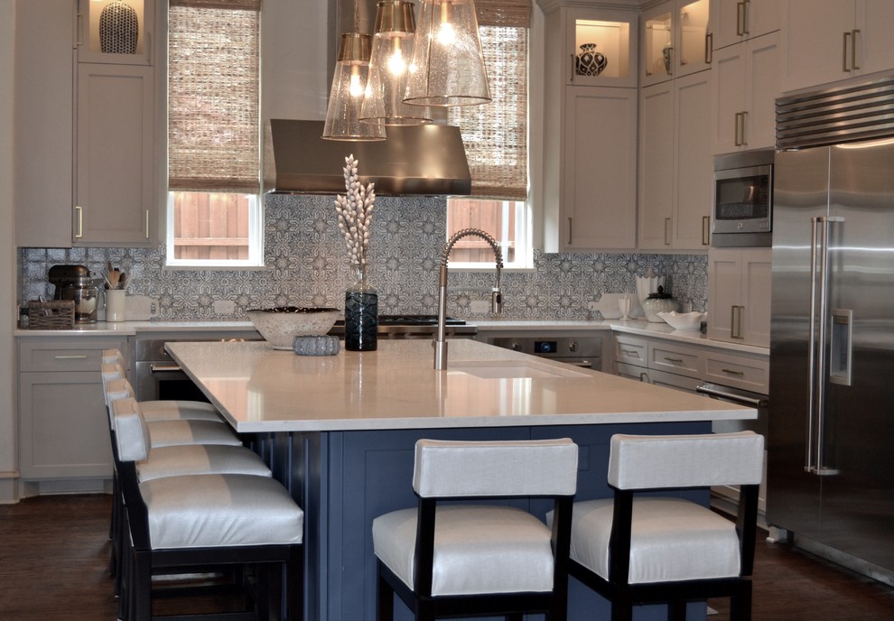 Example of a large transitional l-shaped dark wood floor and brown floor eat-in kitchen design in Dallas with an undermount sink, shaker cabinets, blue cabinets, quartz countertops, blue backsplash, mosaic tile backsplash, stainless steel appliances and an island