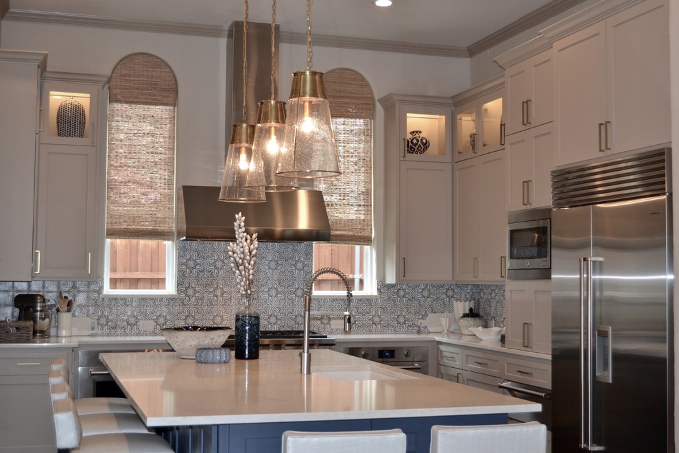 Eat-in kitchen - large transitional l-shaped dark wood floor and brown floor eat-in kitchen idea in Dallas with an undermount sink, shaker cabinets, blue cabinets, quartz countertops, blue backsplash, mosaic tile backsplash, stainless steel appliances and an island