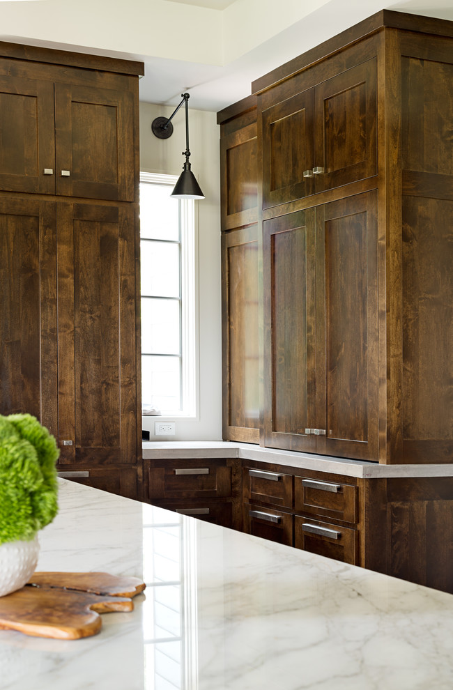 Kitchen - large transitional u-shaped dark wood floor kitchen idea in Other with an undermount sink, shaker cabinets, dark wood cabinets, marble countertops, blue backsplash, subway tile backsplash, stainless steel appliances and an island