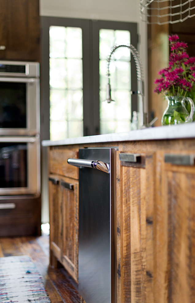 Large transitional u-shaped dark wood floor kitchen photo in Other with an undermount sink, shaker cabinets, dark wood cabinets, marble countertops, blue backsplash, subway tile backsplash, stainless steel appliances and an island