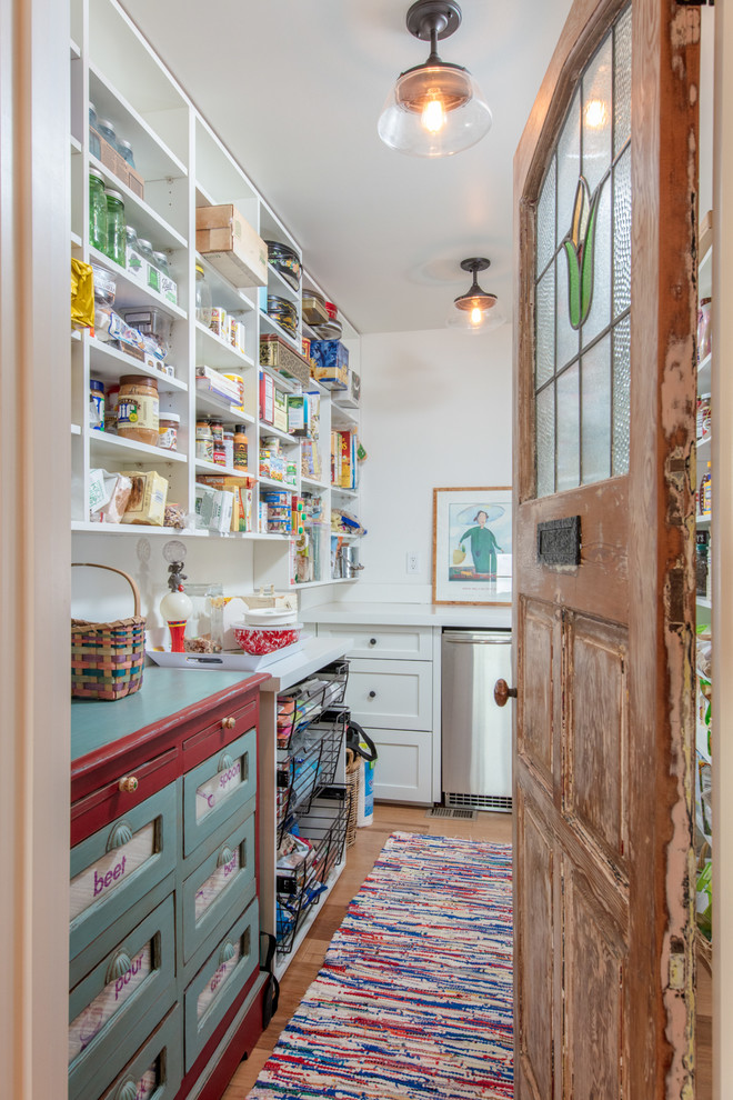 Inspiration for a country kitchen pantry in Other with open cabinets, white cabinets, stainless steel appliances, medium hardwood flooring and brown floors.