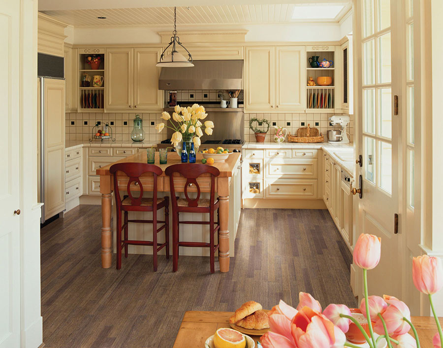 Mid-sized country u-shaped dark wood floor eat-in kitchen photo in Chicago with a single-bowl sink, flat-panel cabinets, white cabinets, tile countertops, white backsplash, porcelain backsplash, white appliances and an island
