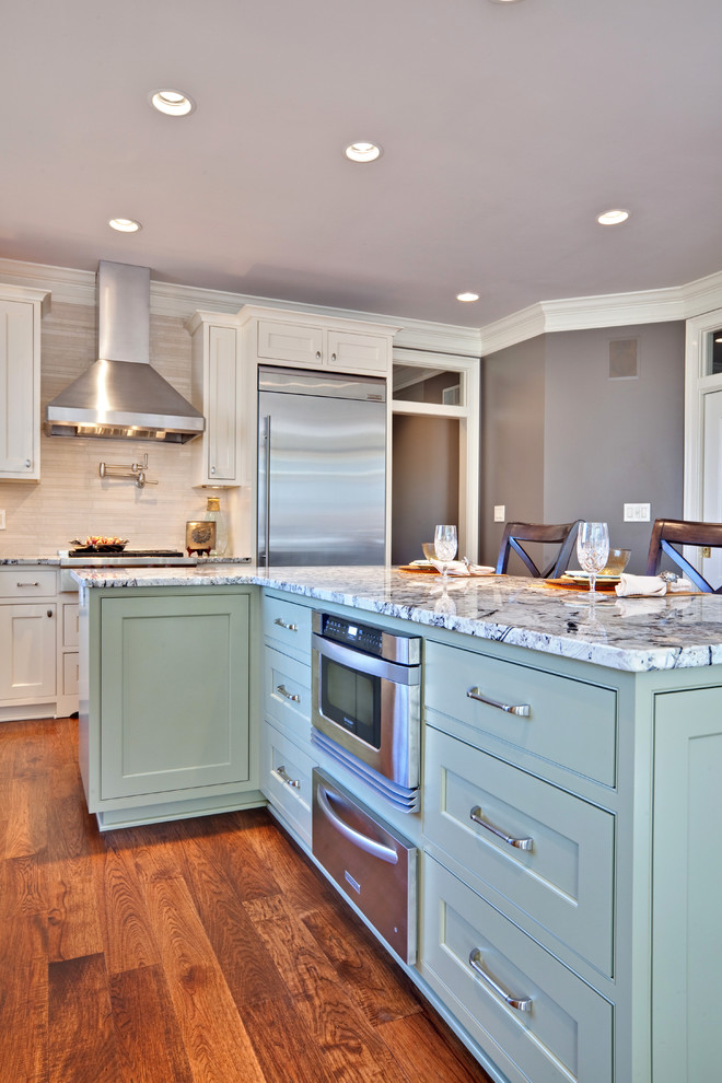 Inspiration for a contemporary kitchen remodel in Atlanta with stainless steel appliances, granite countertops, beaded inset cabinets, green cabinets and beige backsplash