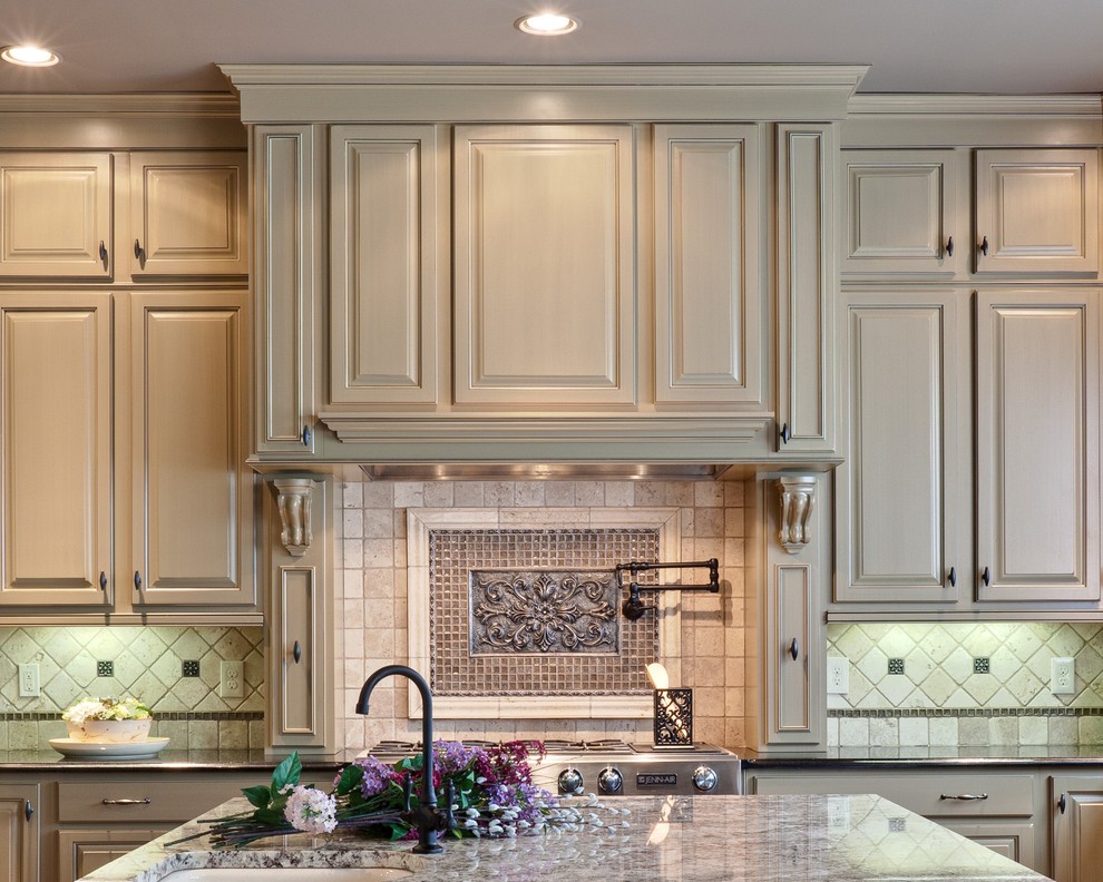 Photo of a traditional kitchen in Atlanta with raised-panel cabinets, beige cabinets and limestone splashback.