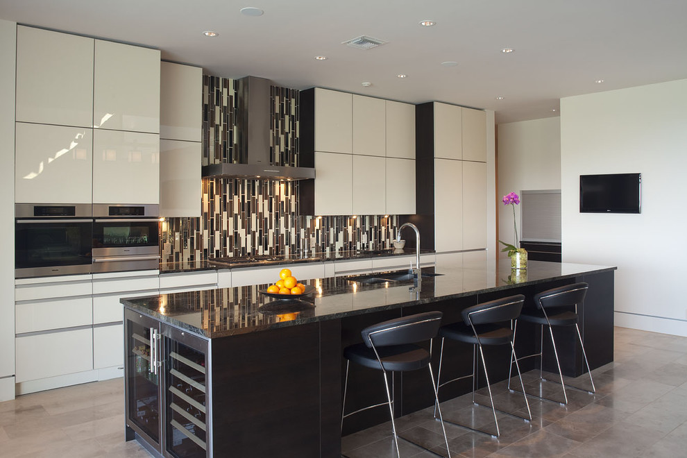 Eat-in kitchen - large contemporary galley porcelain tile eat-in kitchen idea in Austin with flat-panel cabinets, white cabinets, multicolored backsplash, matchstick tile backsplash, a double-bowl sink, granite countertops, stainless steel appliances and an island