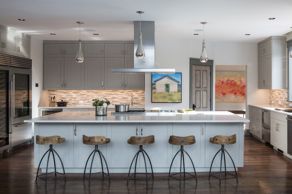 Example of a mid-sized mountain style u-shaped dark wood floor open concept kitchen design in Other with shaker cabinets, gray cabinets, gray backsplash, matchstick tile backsplash and an island