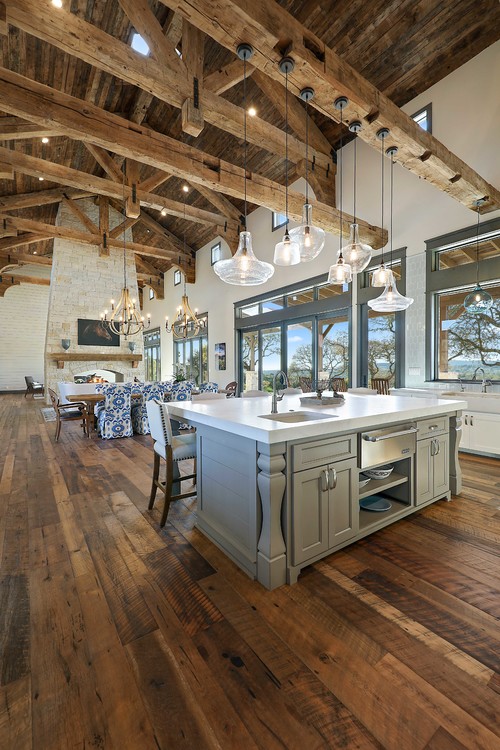 Elevated by Design: Exposed Beam and High Vaulted Ceiling Kitchen with White Ceramic Backsplash