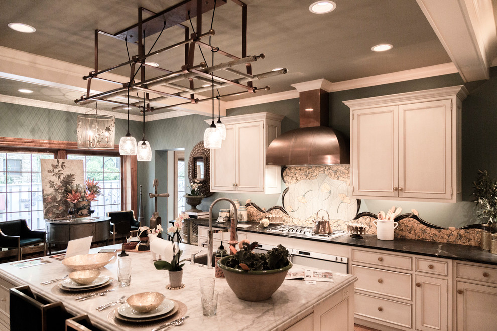Large eclectic u-shaped enclosed kitchen photo in Kansas City with an island