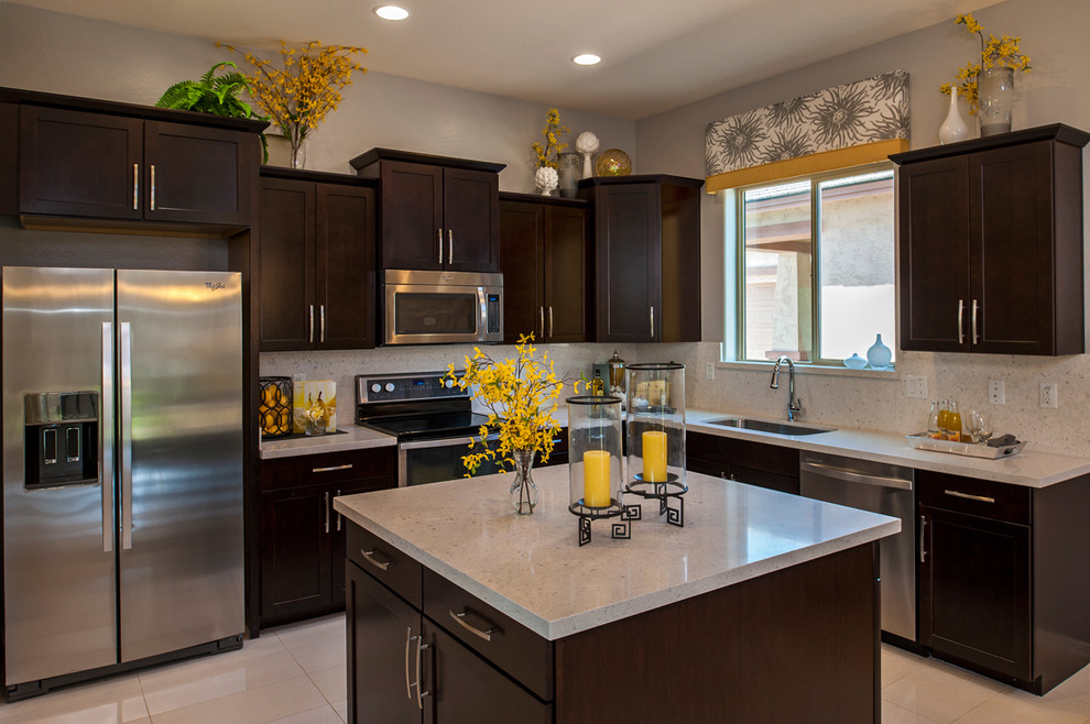 This is an example of a contemporary kitchen in Phoenix with stainless steel appliances.