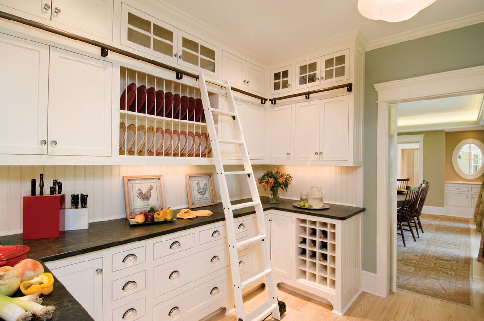 Design ideas for a traditional kitchen in Boston with recessed-panel cabinets and white cabinets.