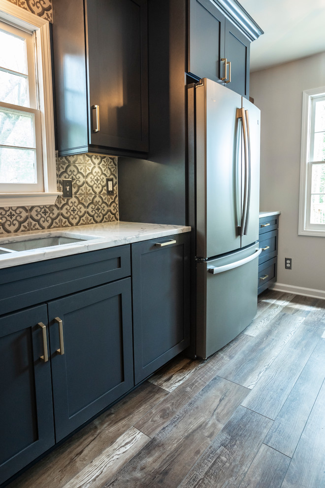 Small minimalist galley vinyl floor and multicolored floor enclosed kitchen photo in Atlanta with an undermount sink, shaker cabinets, blue cabinets, quartz countertops, multicolored backsplash, porcelain backsplash, colored appliances, no island and gray countertops
