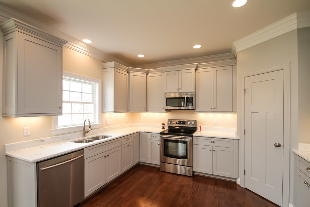 Inspiration for a craftsman u-shaped eat-in kitchen remodel in Richmond with shaker cabinets, gray cabinets, granite countertops and stainless steel appliances